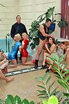 Five dirty chicks wearing latex suits fuck hard in the spa