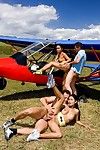 Two asian strumpets swallowing schlong and fucking by private airplane