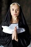 Cosplay solo girl Sara Sloane strips off nun\'s uniform for pornstar shoot