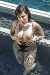 Tattooed Latina babe Dollie Darko skims bikini bottoms down to as mother gave birth waste