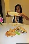 Thai cutie eating burger