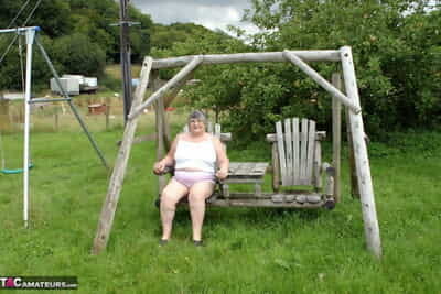 Grey British explicit Grandma Libby exposes the brush knockers not susceptible a personal space horse-racing gin-mill..