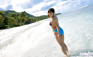 Breasty oriental queen with cool apple bottoms Aya Hirai slipping off her bikini outdoor