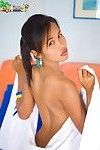 Ebony Thai hottie Lily Koh wearing barely a towel and shy smile