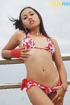Pretty Thai adolescent in bikini plays peek-a-boo with her arse