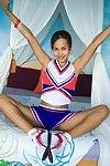 Fond Japanese youthful cheerleader flashes cotton underclothing