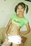 Thai infant beauty with pigtails and shorts