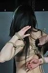 Japanese servitude lass in oriental kinbaku and rope turns over