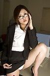 Office Lass In Glasses Wearing A Swarthy Outfit Flashes Her Shorts At Her Desk.