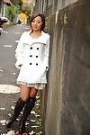 Darling Modelling Her White Coat And Swarthy Boots In Public.