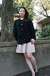 Outdoor posing scene featuring horny Asian mature Yoshiko Makihara