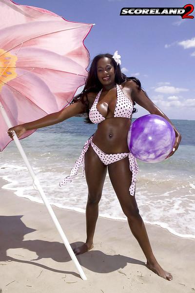 Black mom Nikki Jaye freeing huge juggs from bikini outdoors on beach