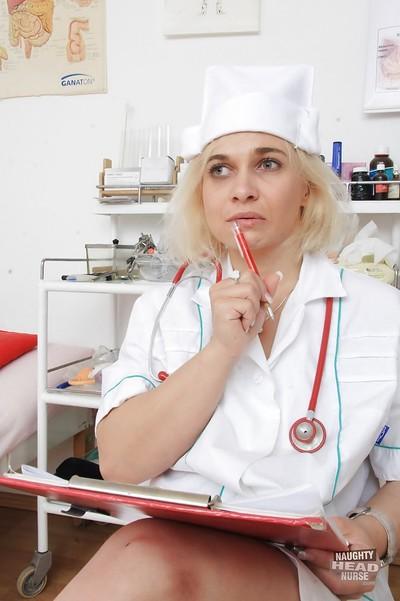 Older blonde nurse Sandy masturbating and toying bald cunt on exam table