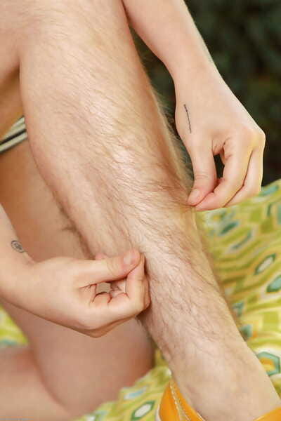 Older redhead lady Velma displaying extremely hairy legs outdoors