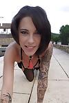 Tattooed MILF solo girl Nikita Bellucci showing off nice ass outdoors