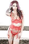 Tattooed MILF solo girl Monique Alexander strutting in nylons and lingerie