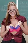Smiley blonde teacher in glasses uncovering her ravishing curves