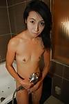 Skinny asian MILF with hard nipples taking shower and rubbing her soapy body