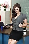 Stunning teacher in dress clothes revealing her goods in the classroom