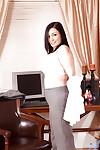 Michelle Bond is brunette businesswoman and MILF who loves to strips in her office.