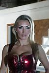 Sexy MILF in fishnet stockings Tanya Tate uncovering her big round tits