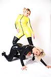 Non nude posing scene featuring Dannii Harwood and Lucy Zara in latex