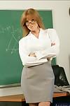 Redheaded teacher in glasses Darla Crane showing off bare MILF curves