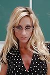 Milf teacher in sexy glasses and stockings Regan Anthony poses