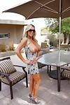 Naughty housewife in sunglasses uncovering her amazing big tits outdoor
