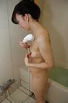 Asian housewife Mako Shinozuka takes a hot shower while all alone