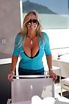 Smiley mature bombshell in sunglasses reveals her huge jugs outdoor