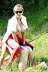 Lusty mature lady in sunglasses tortures her manslave outdoor