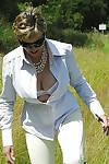Busty mature femdom in sunglasses tortures her boyslave outdoor