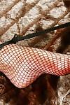 Lady Sarah and fishnet clad submissive engage in lezdom sex games