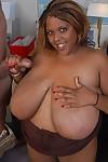 Chesty black fatty Minxx taking cumshot on massive black breasts