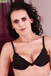 Older lady Jana Barret posing solo in black bra and stockings