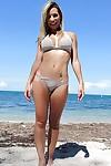 Latina babe Patty drops her bikini bra and flashes tits on the beach