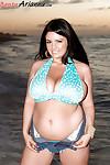 Chesty brunette chubby Arianna Sinn releasing big knockers from bikini