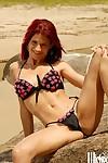 Redhead MILF babe Dany Duran drops her bikini to enjoy her naked body