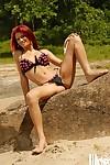 Redhead MILF babe Dany Duran drops her bikini to enjoy her naked body