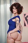Tall and tattooed mom Joslyn James posing fully clothed in long dress