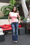 Hot MILF Ava Addams posing topless outdoors in jeans and high heels