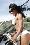 Ebony milf babe Kiki Minaj shows off her big tits in white bikini