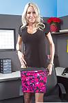 Blonde milf Emma Starr shows her big boobies and black stockings