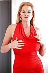 Big tits blonde babe Kelly Madison is posing in her red skirt