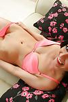 Brunette mom Roxanne Cox posing on couch in pink bra and underwear