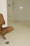 MILF babe with a big booty Ava Addams  poses naked solo in the shower