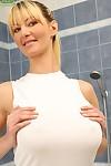 Older blond Vanessa Lovely takes her large natural tits to the shower