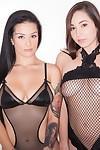 MILF lesbian Katrina Jade and busty teen Karlee Grey posing in fetish wear