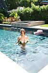 Sexy big tit pornstar Sarah Nicola swimming in the pool